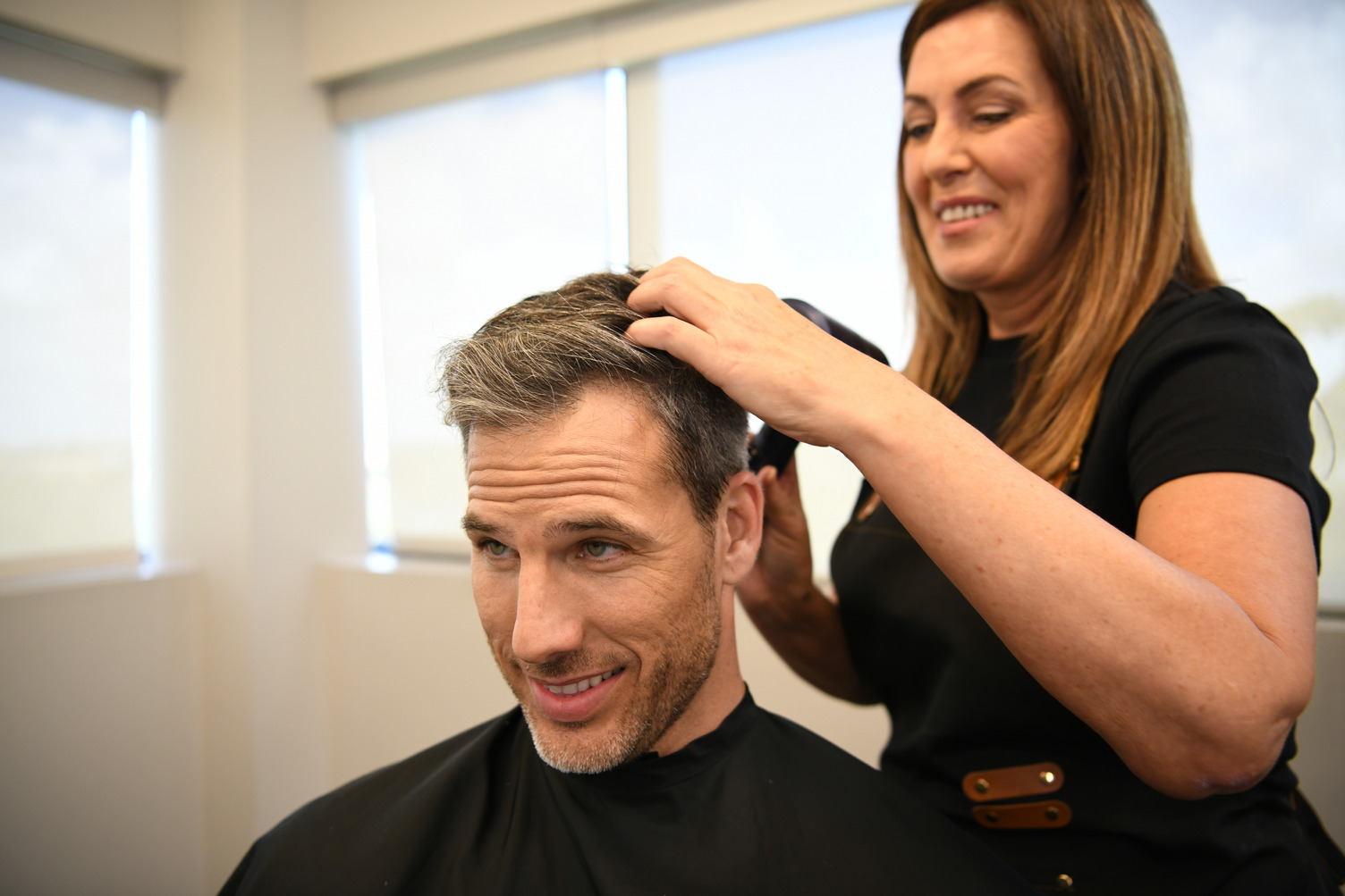 Care team supporting a smiling client
